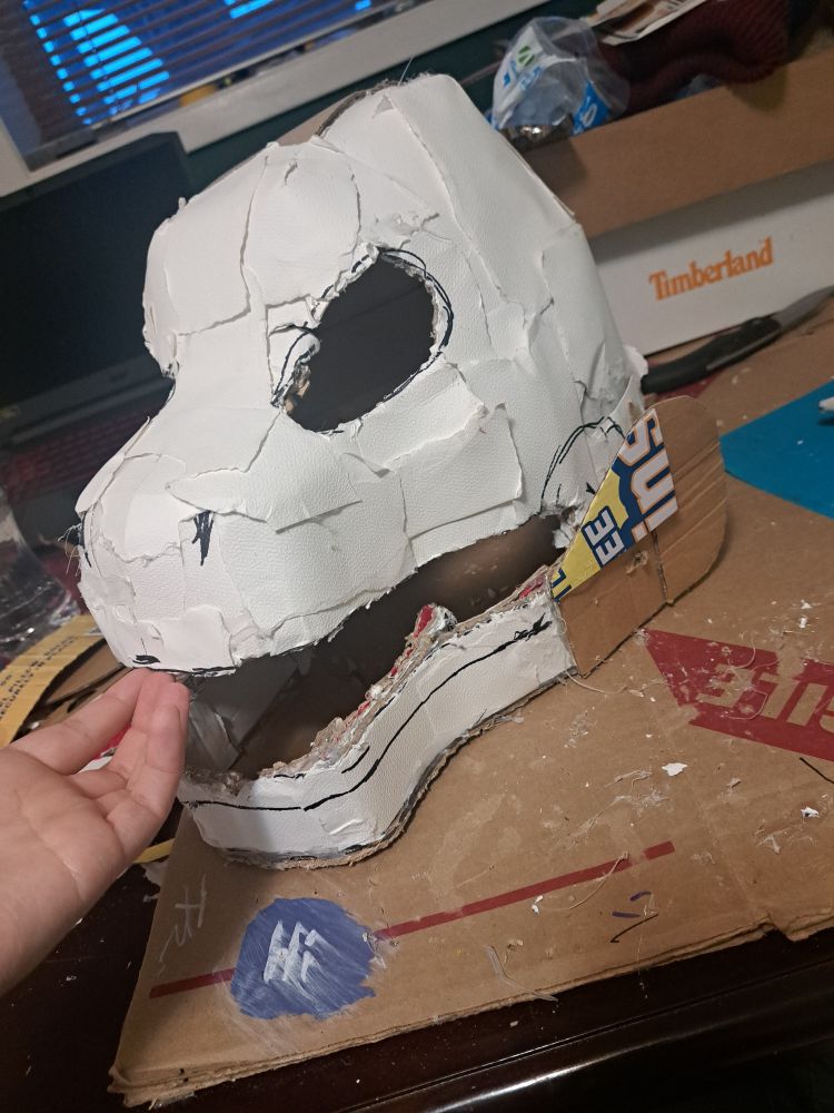 A cardboard/papier-mache godzilla head in progress