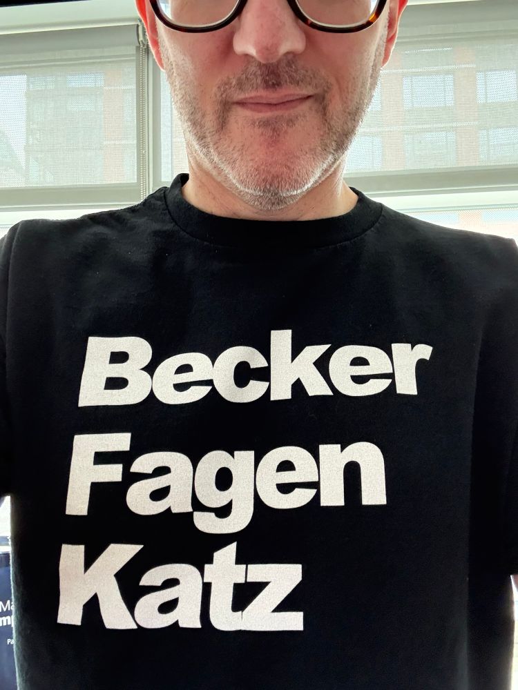 Me wearing a t-shirt that says “Becker, Fagen, Katz”, procured from oldskoolhooligans.com