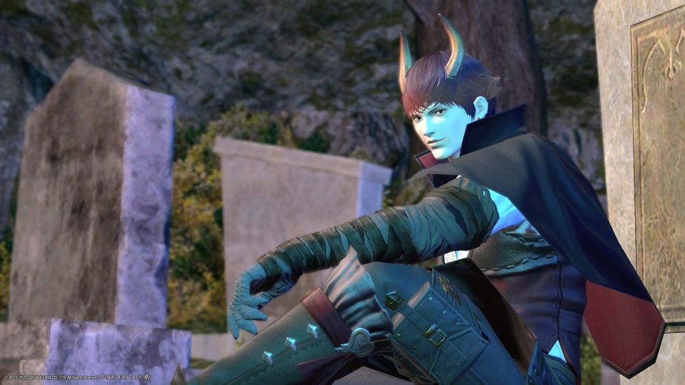Vampire Demon Kiaran Thorne sitting in a graveyard
