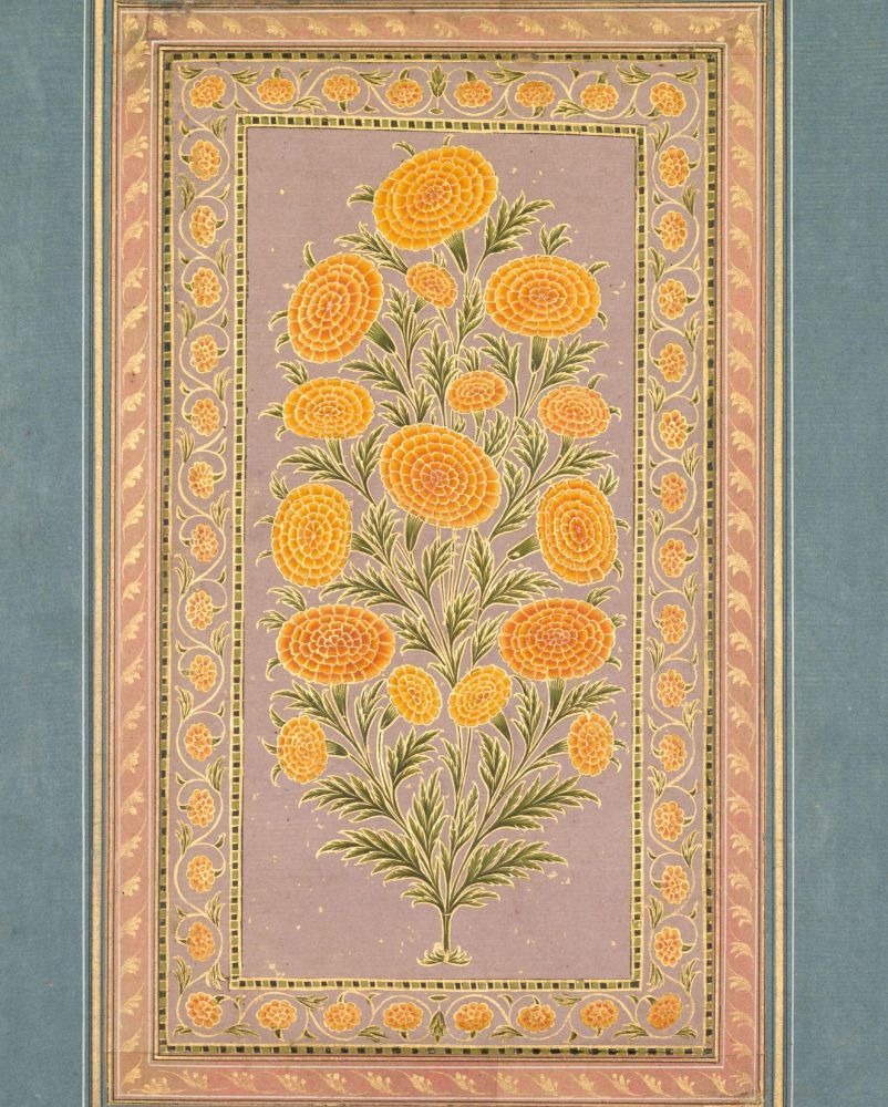 Decorative floral rug featuring a central motif of golden marigolds with green leaves and detailed pink borders, set against a soft blue background.