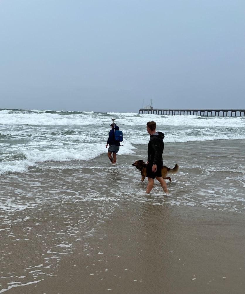 Seth walking into the swash during the walking survey, as buddy Austin and his pup Summit keep an eye on him. Waves are breaking almost as far out as the end of the pier in 6-m water