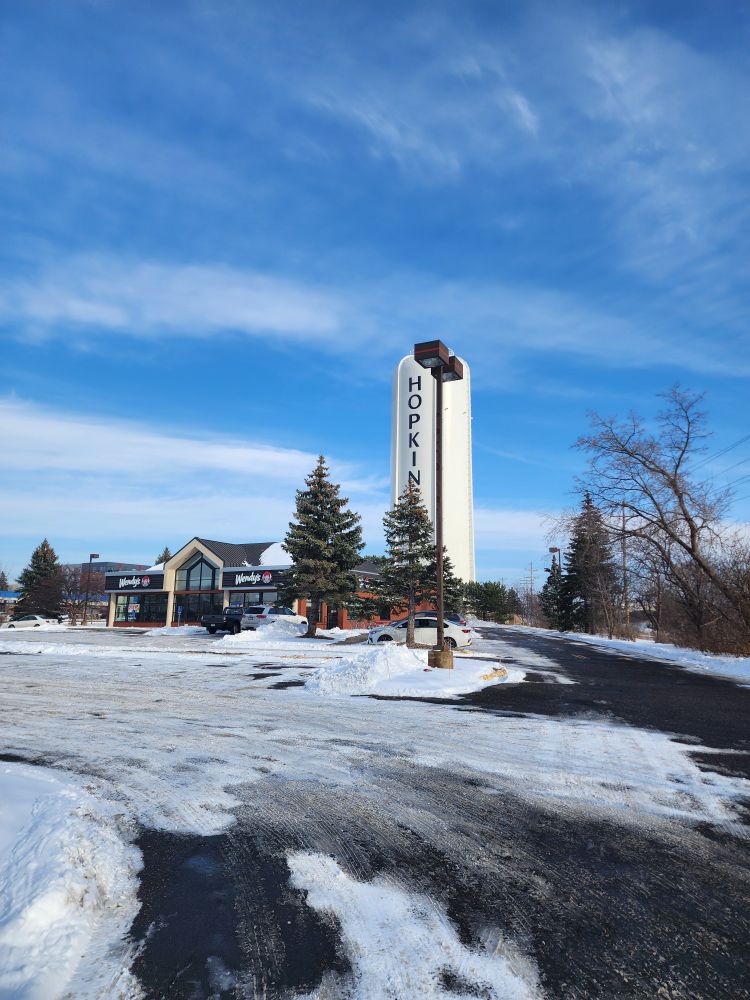 Hopkins water tower behind a Wendy's 