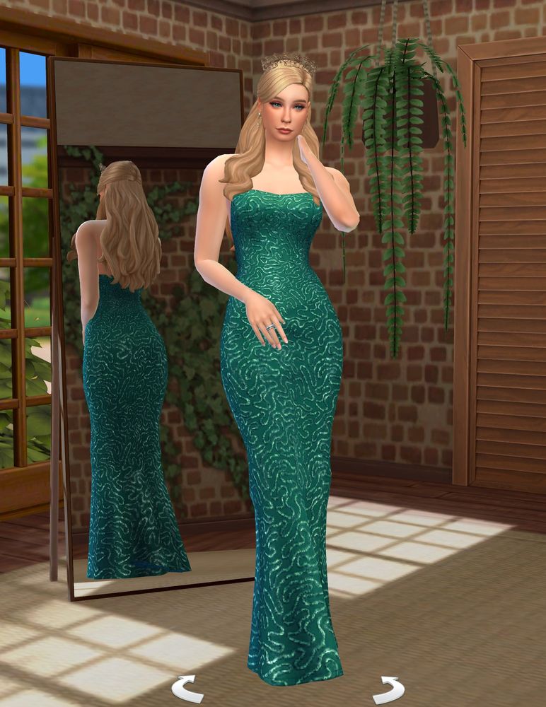 blonde sim in a long green dress with a crown
