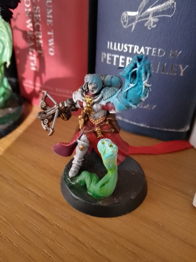 The leader of the squad with a modded power fist with electric pentacle