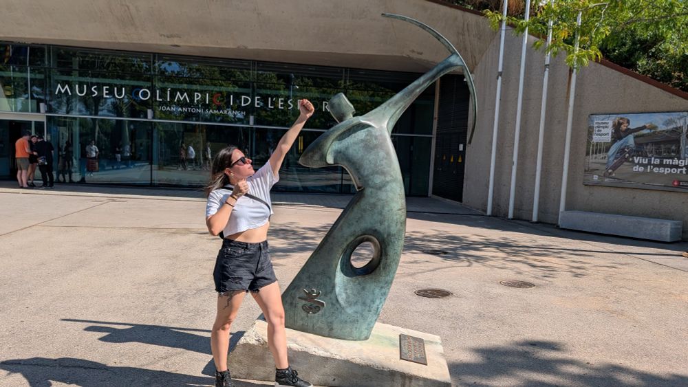 Marina posing next to the statue in homage to Antonio Rebollo, the archer who lit the olympic flame using a bow.