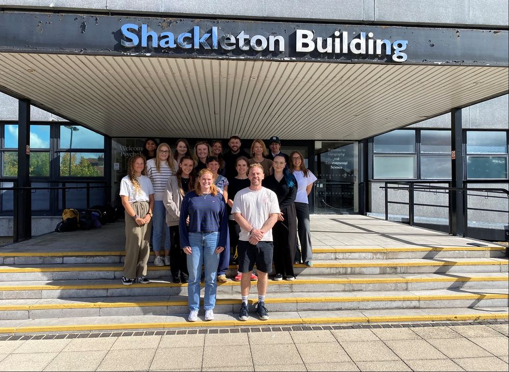 the 2025 cohort standing outside the psychology building
