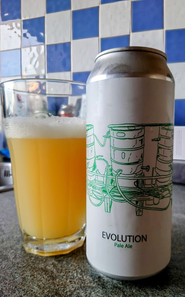 A can of Evolution beer by Fidens Brewing with a glass of beer beside the can.
