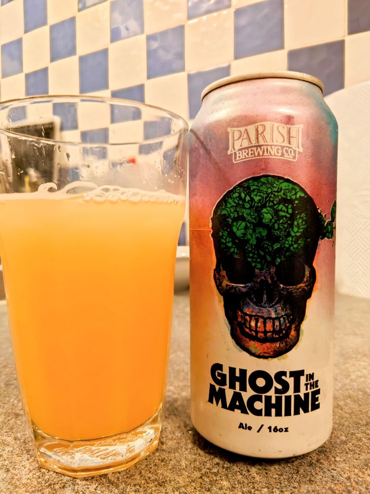 A can of Ghost in the Machine by Parish Brewing Co, with a glass of the beer