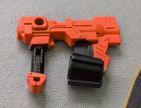The HG Gunleon gunpla's nailgun painted black and orange.