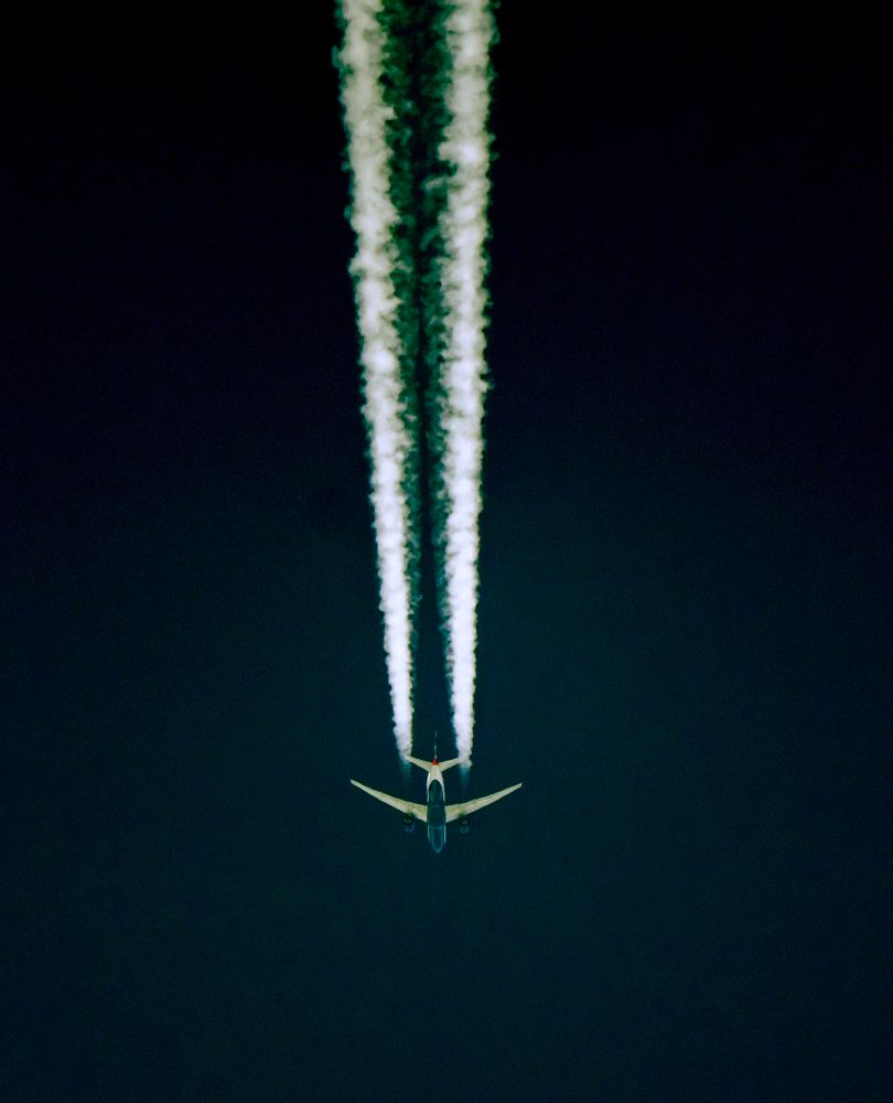 A BA flight heading for warmer climes leaving a crisp contrail.