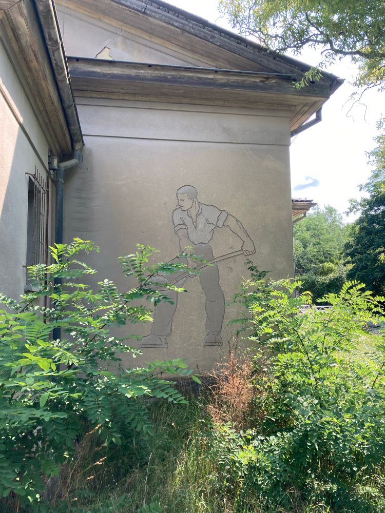 mural shows worker with shovel