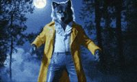 Gif of a werewolf dancing sexily in a yellow trench coat and bluejeans