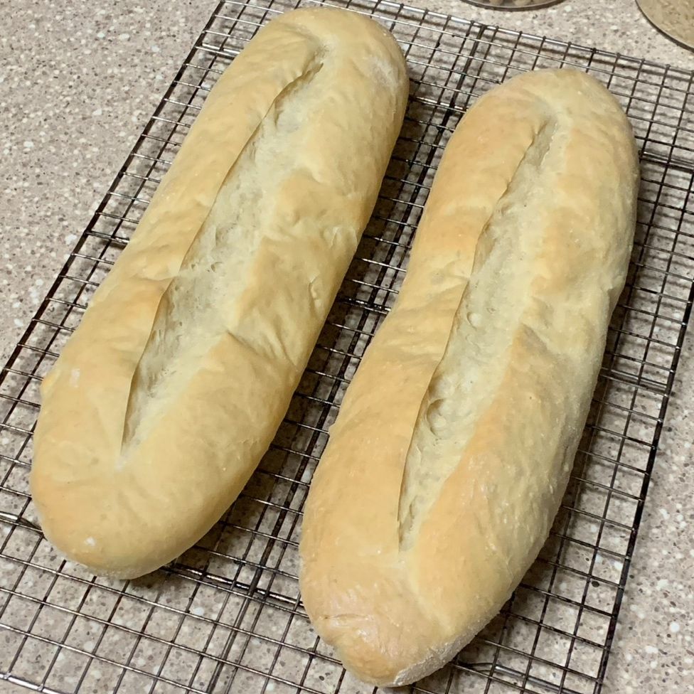 Homemade Cuban bread on a drying rack