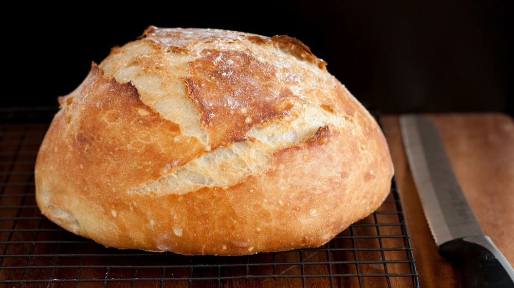 A crispy golden loaf of homemade bread