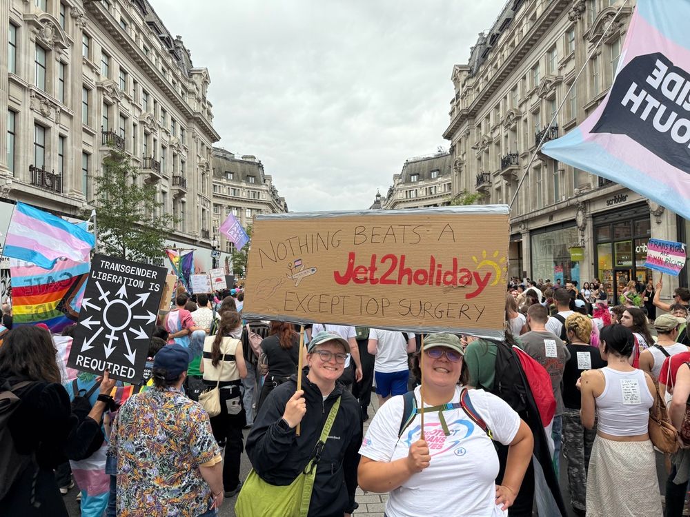 Vincent and Cathryn with their sign surrounded by people
