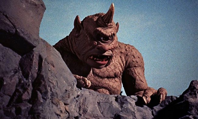 A still of the cyclops looming over a cliff edge from The Seventh Voyage of Sinbad.