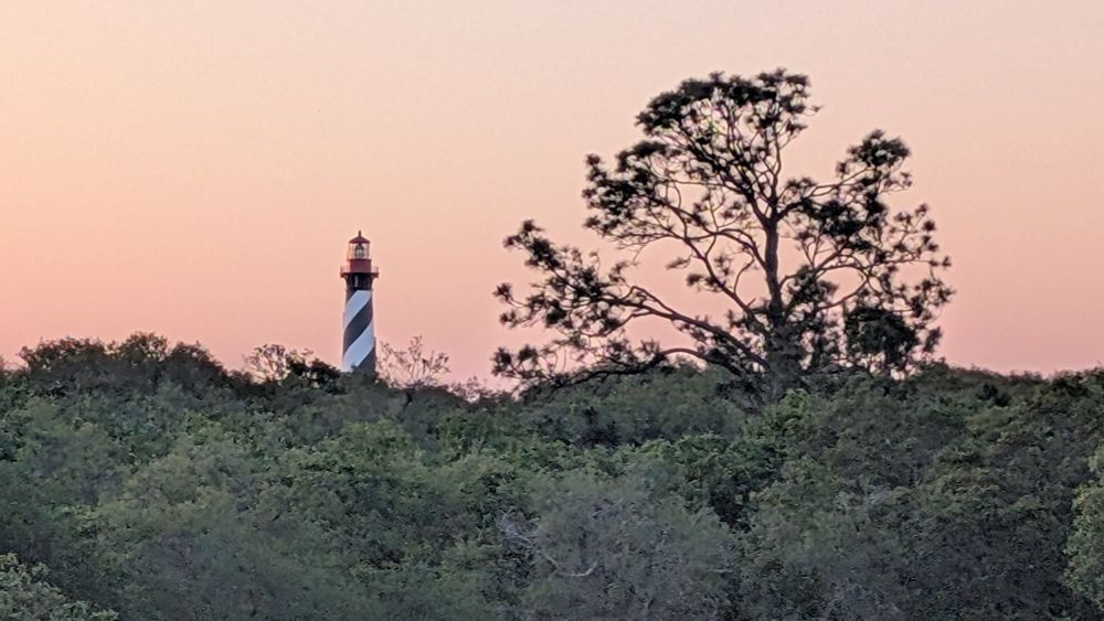 St. Augustine lighthouse against the setting sun sky
