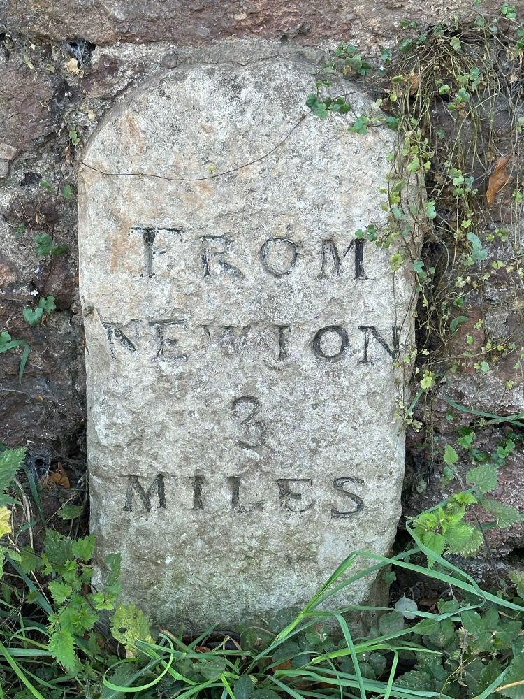 Stone milepost - From Newton 3 miles