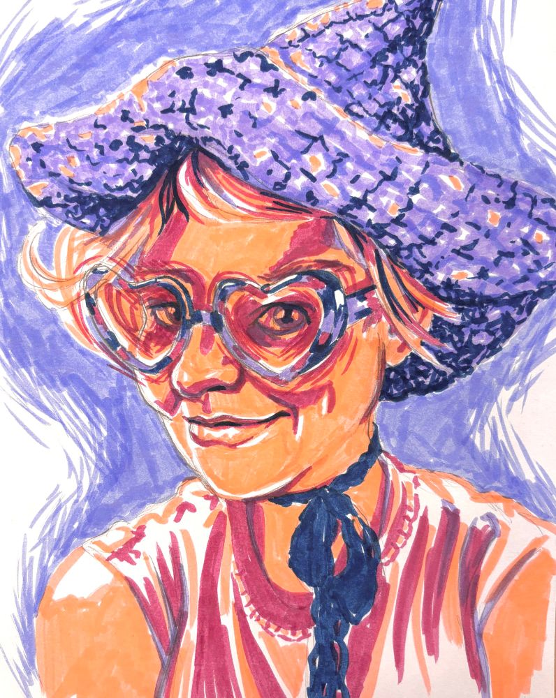 Maker portrait of my girlfriend, Kendall. She wears a crochet wizard hat, heart shaped glasses, and a lace ribbon tied around her neck.