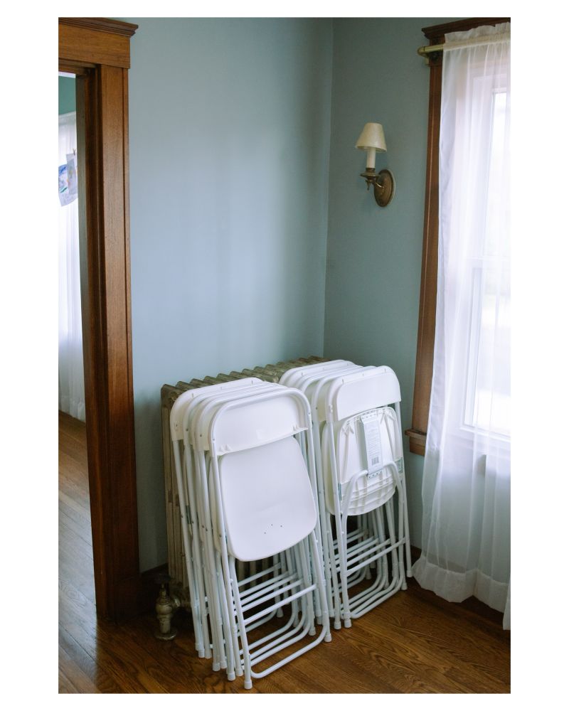 A color photo of chairs stacked and waiting to be put away. 

Malden, MA. 2025.