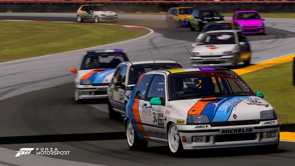 My #34 Renault Clio winding through turns 7 and 8 on Mid-Ohio Sports Car Course with a stream of other Clios behind my car.