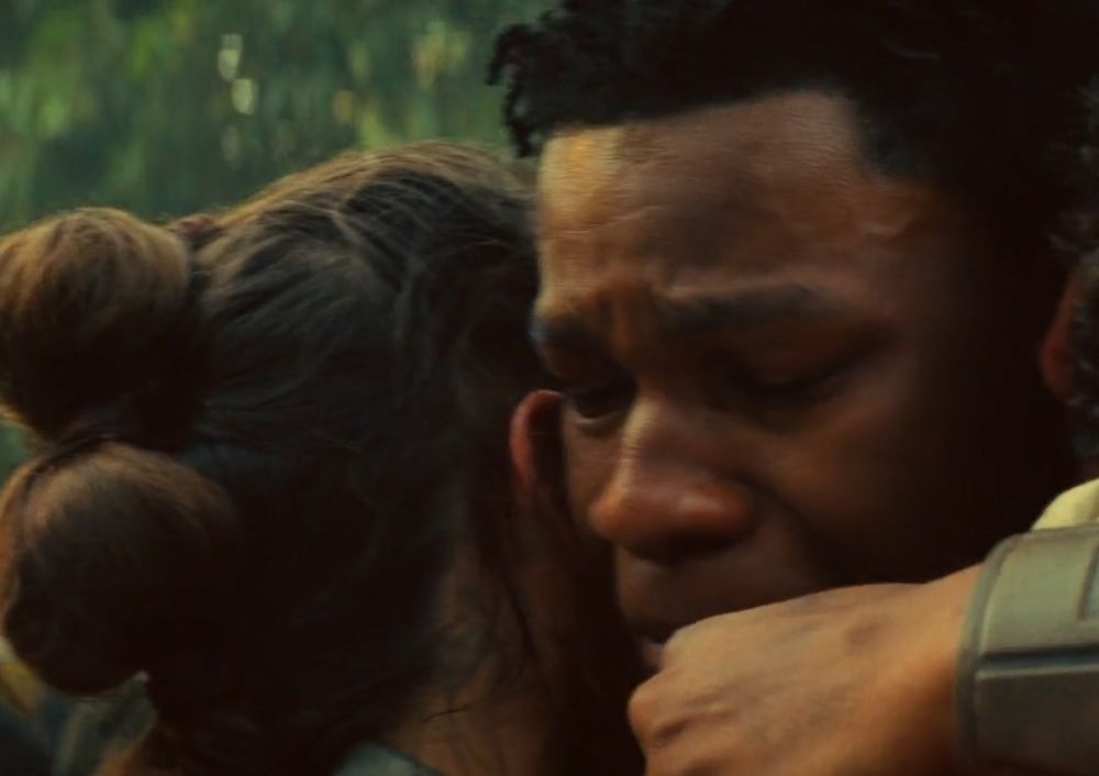 Finn looks in pain, like he's holding back tears.