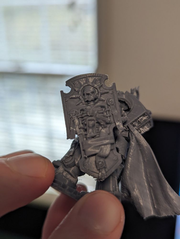 Miniature 3d printed model of a warrior with a skull face