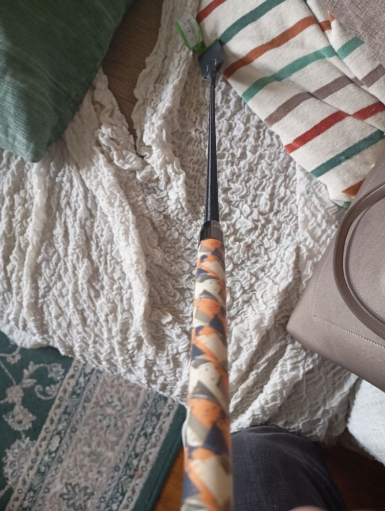 It's a fricking riding crop with an orange camo handle