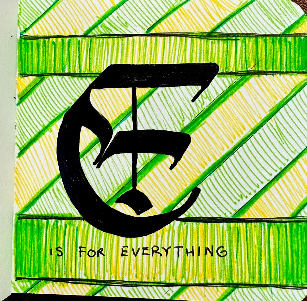 A proper fraktur type “E” in black with yellow and green stripes. Other text reads “is for everything”