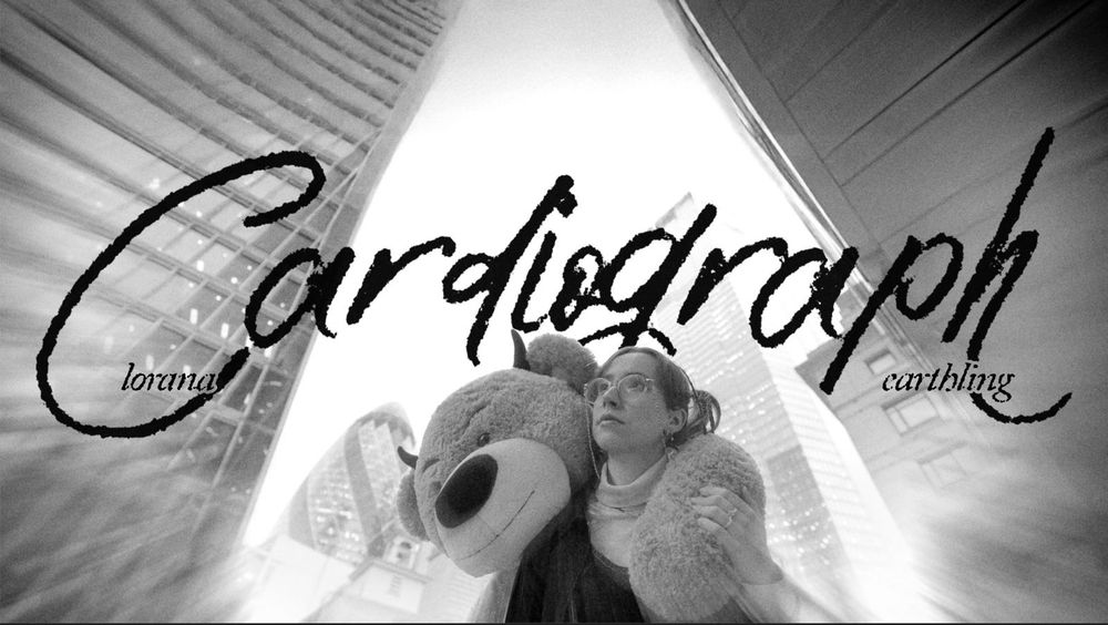 cardiograph by lorana youtube thumbnail depicting lorana with a giant teddy on her back in the city