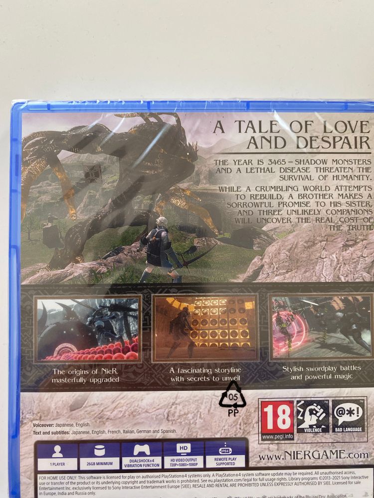 Photograph of the back of the box for Nier Replicant on PS4 showing off a more intriguing description of the world and lore of the game to grab the potential audience 

“A TALE OF LOVE AND DESPAIR
THE YEAR IS 3465 - SHADOW MONSTERS AND A LETHAL DISEASE THREATEN THE
SURVIVAL OF HUMANITY.
WHILE A CRUMBLING WORLD ATTEMPTS TO REBUILD, A BROTHER MAKES A SORROWFUL PROMISE TO HIS SISTER, AND THREE UNLIKELY COMPANIONS WILL UNCOVER THE REAL COST OF
THE TRUTH.”

“The origins of NieR masterfully upgraded”

“A fascinating storyline with secrets to unveil”

“Stylish swordplay battles and powerful magic”