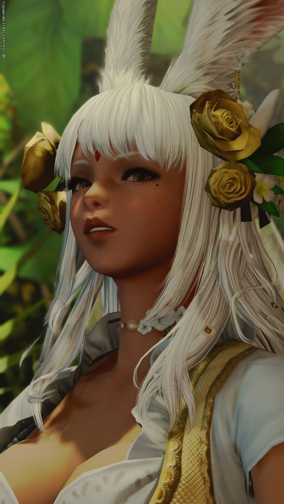 Eir, a viera woman, standing in front of a verdant plant wall. She wears gold flowers on her white hair, and she looks down at the camera with an upturned (and unimpressed) face.