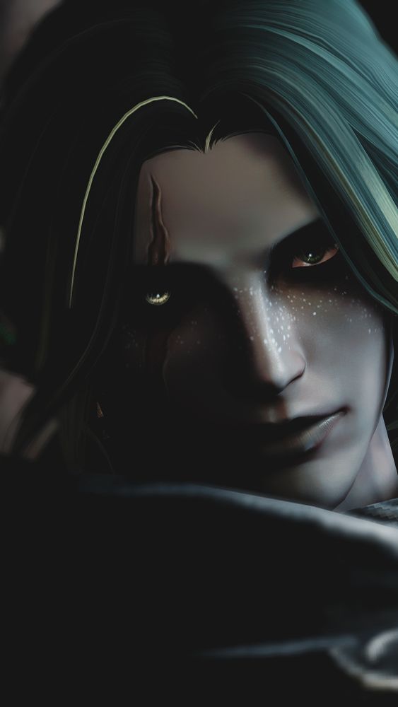 closeup of zei's face, looking at the camera. one side is shaded in shadow.