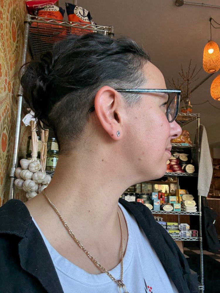 The full undercut revealed in profile as I’ve pinned my hair into a bun at roughly the line of the cut.