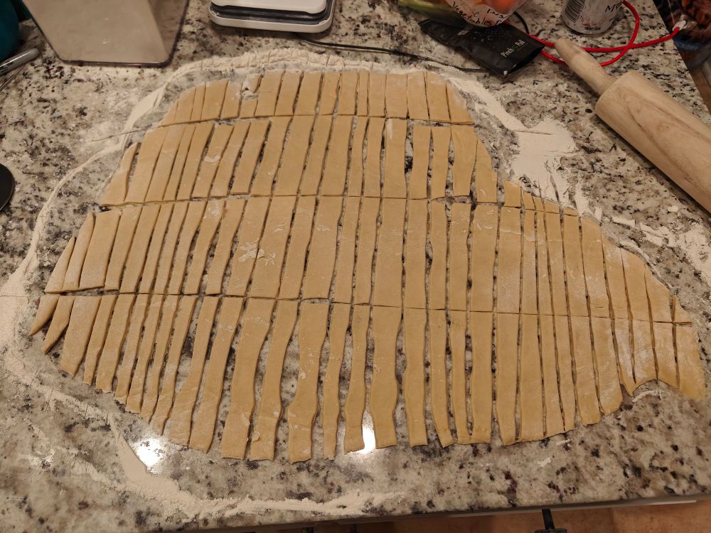 Hand cut noodles on a countertop 
