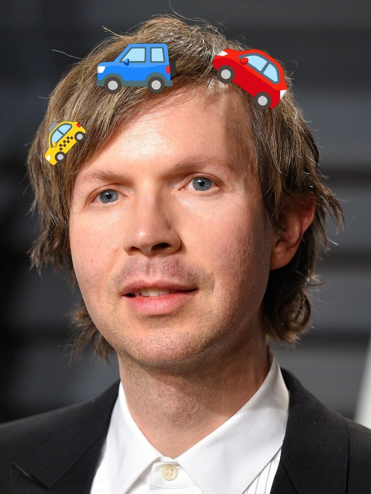 The musician Beck with car emojis on his head