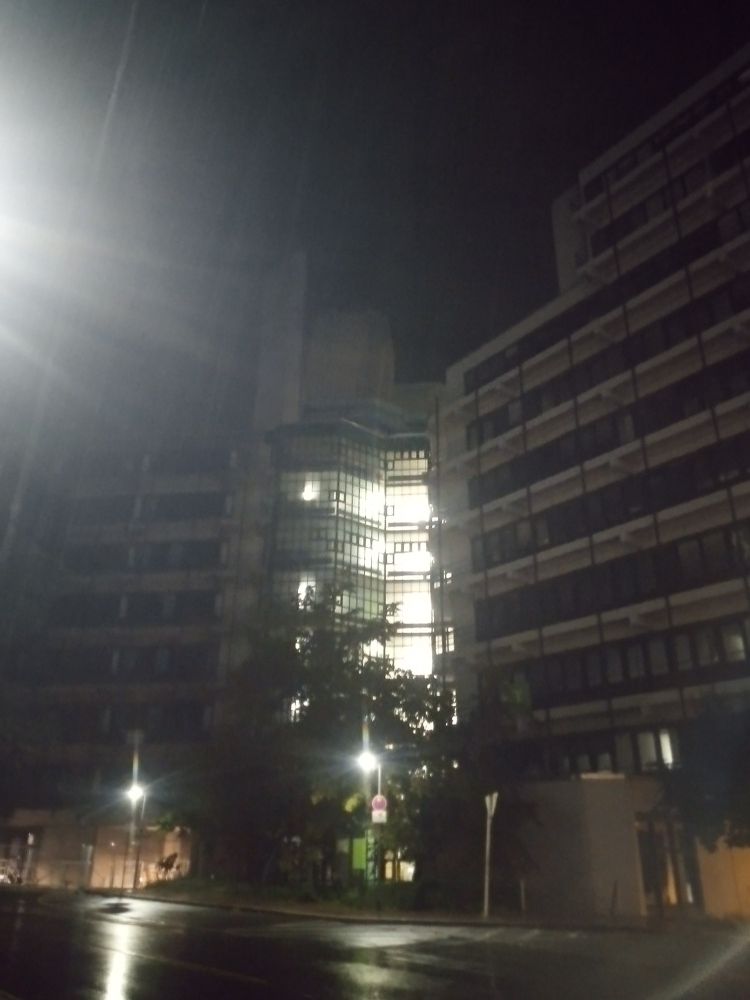 Some of the side buildings at night.