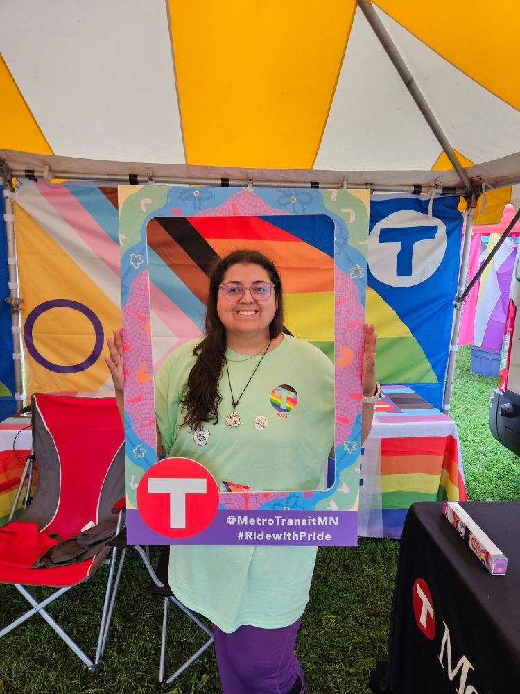 Jenna holding a Metro Transit frame 
