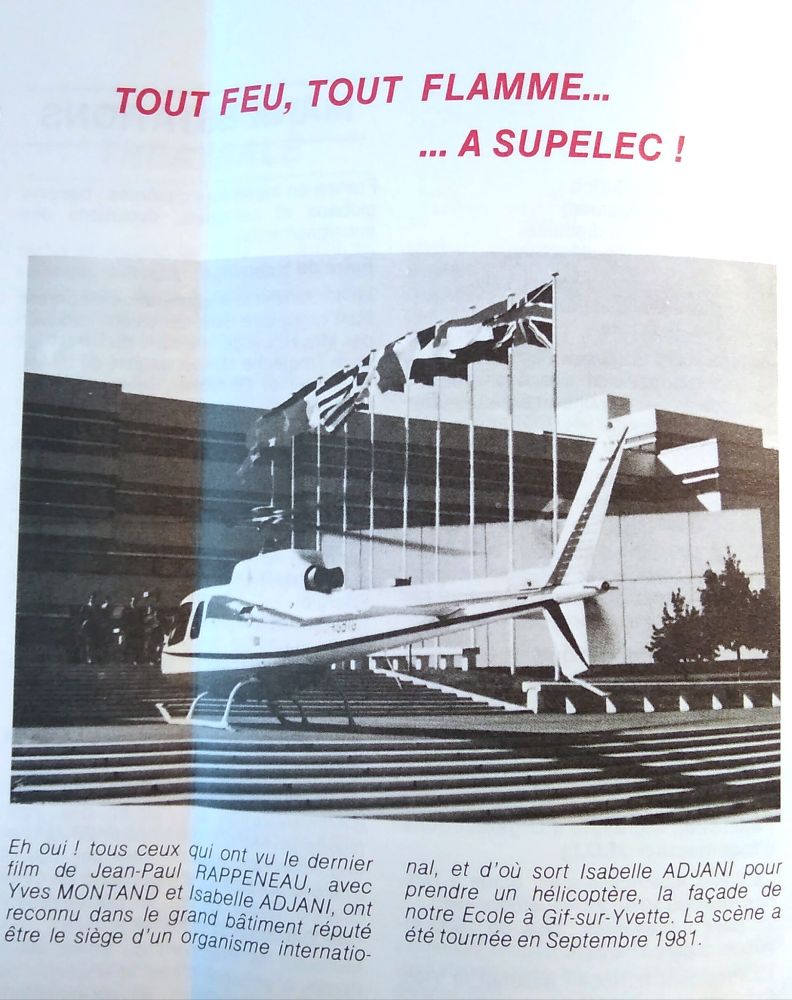 Article de journal illustré par un hélicoptère sur les marches du bâtiment Bréguet, avec des drapeaux internationaux flottant au vent. Titre de l'article : "Tout feu tout flamme... à Supélec!"