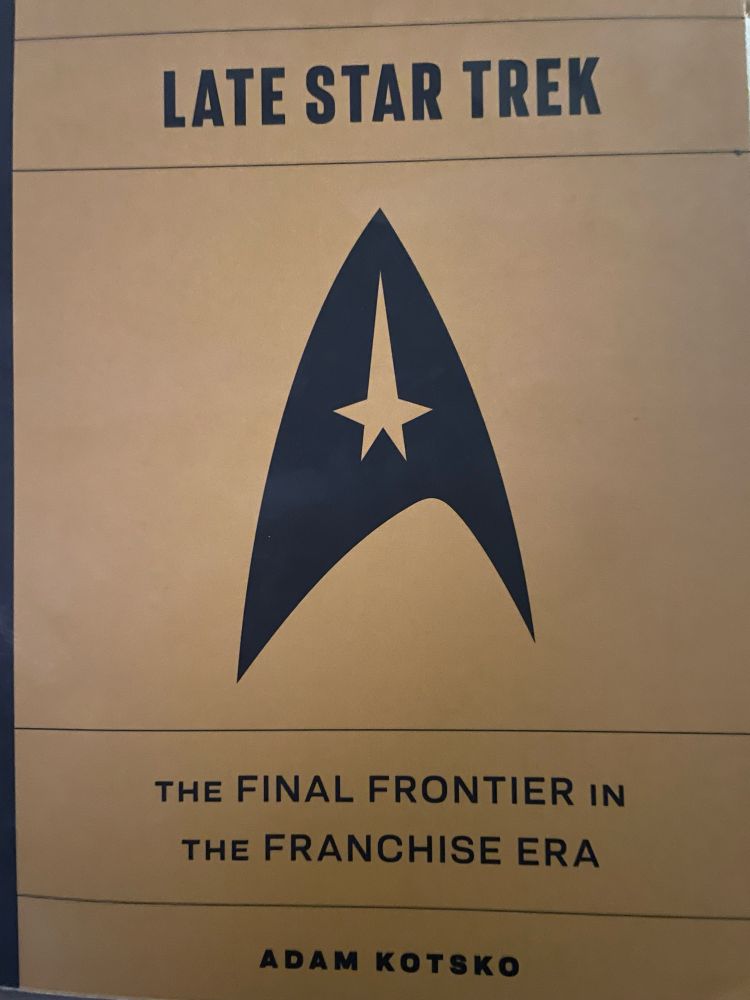 An image of a yellow book with a Star Fleet badge in the centre. It is entitled LATE STAR TREK THE FINAL FRONTIER IN THE FRANCHISE ERA And it is by ADAM KOTSKO