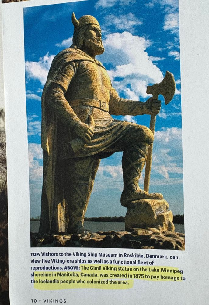 A magazine photo of the Gimli Viking statue with a blue sky dotted by white clouds in the background. The statue was unveiled in 1967.