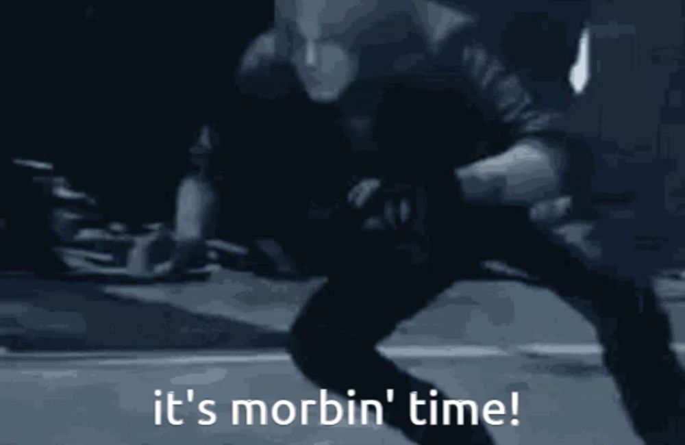 a blurry picture of a man with the words it 's morbin ' time