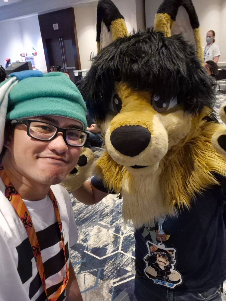 Photo of the user with Teo in partial fursuit.