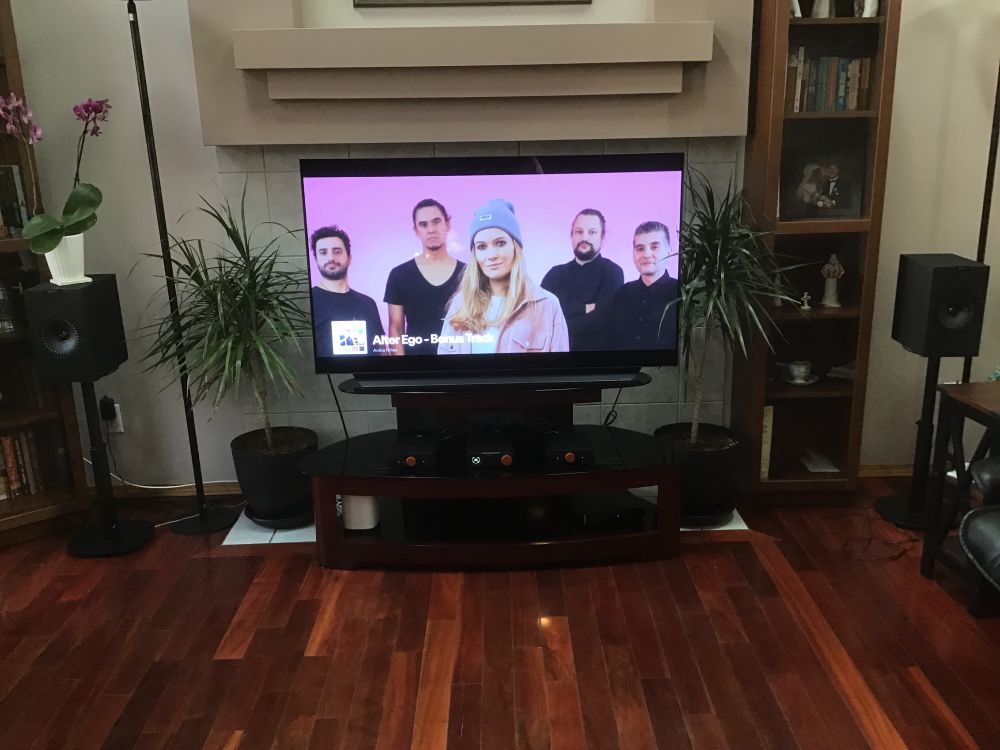 A tv is pictured with stereo speakers and amplifiers positioned near it