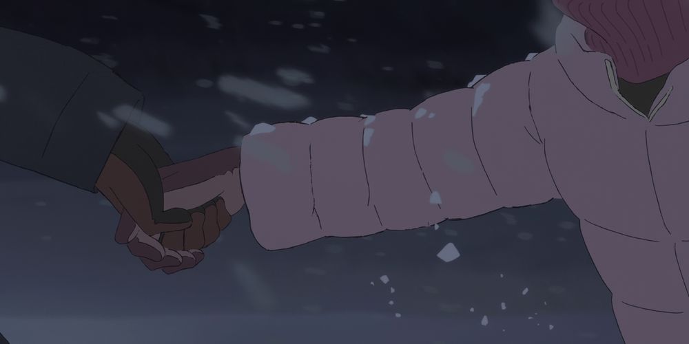 fujino and kyomoto hold hands through the snow