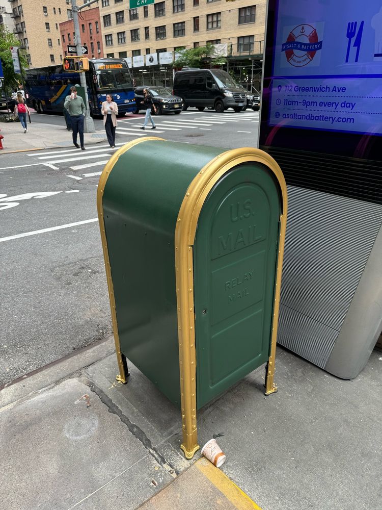 Green and gold mailbox on NYC street