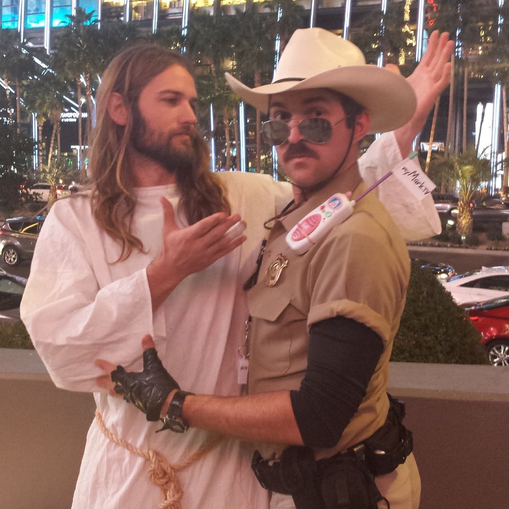 years ago my Lt. Frank busking character looks directly into camera as he hugs a "Jesus" street performer on the Las Vegas Strip across from the Cosmopolitan