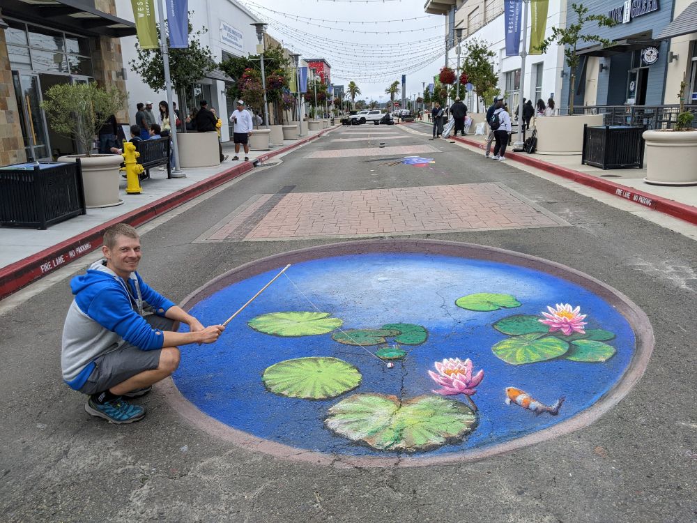 Fishing in 3D koi pond street art mural in Daly City, CA. 12ft wide x 15ft long.