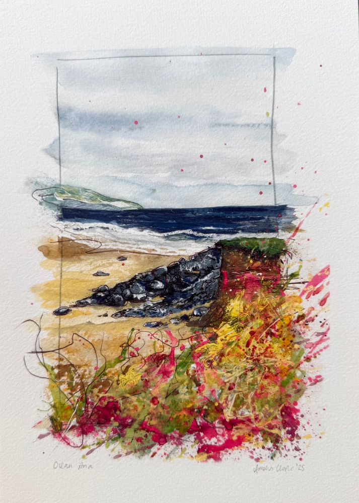 A foreground riot of Brilliant Opera Rose pink and yellow, rocks and a headland and foamy seas thundering onto the beach at Porthmeor in Cornwall