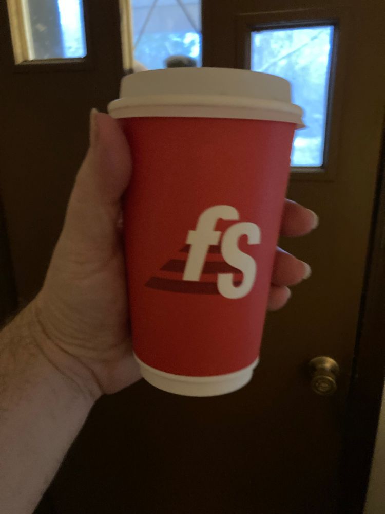 A to go coffee cup from the local Fast Stop. It’s the “good” gas station coffee